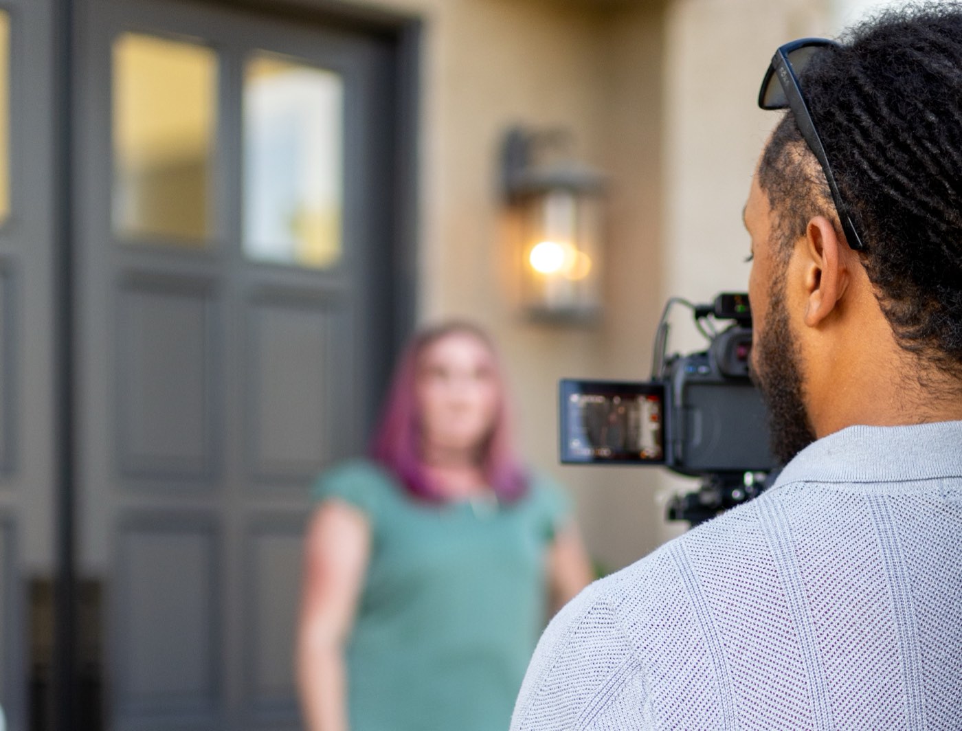 Stillwater videographer filming an agent at a listing's front door