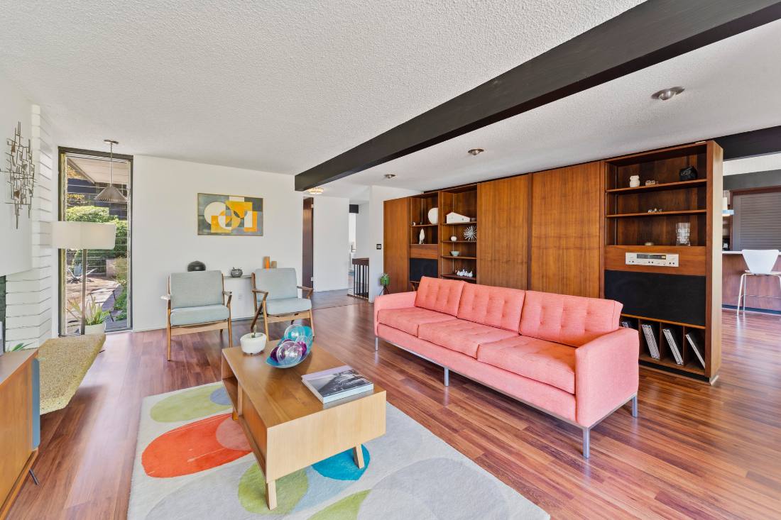Mid century living room, pink sofa and walnut wall