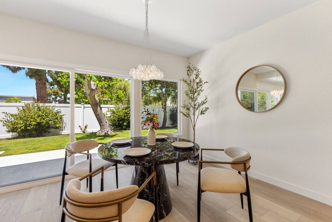 Dining nook, black marble table, garden view