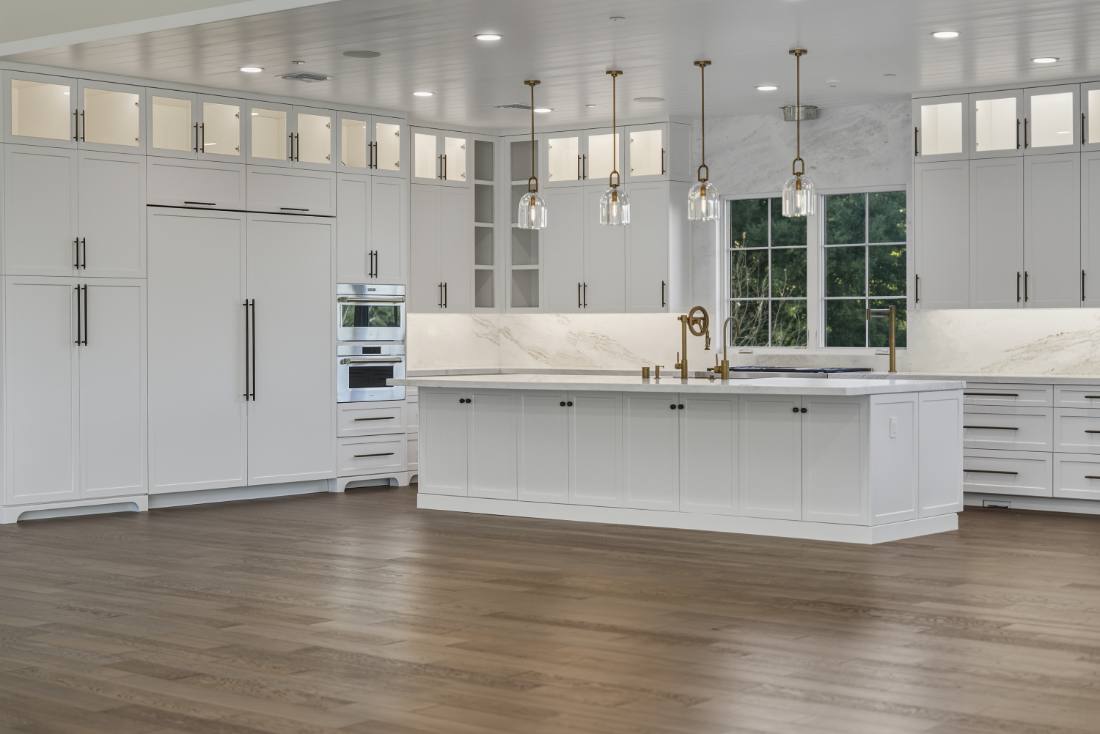 Estate kitchen, brass pendants and marble slab