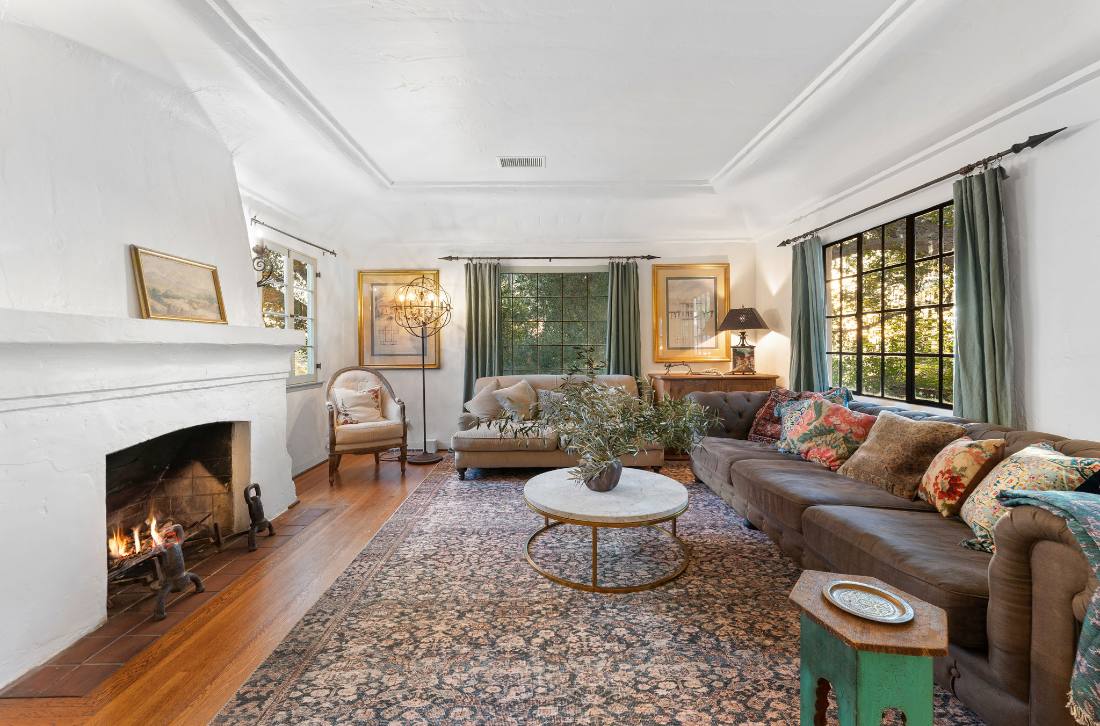 Spanish living room, fireplace and steel windows